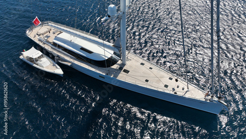 Aerial drone photo of beautiful sail boat anchored in deep blue Aegean Sea