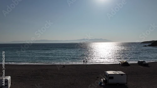 Sunset and people on the beach