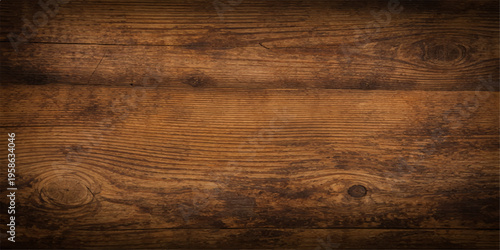 Old grunge wood texture features a dark brown natural grain pattern on a rough timber plank surface suitable for an aged wooden floor or wall panel design