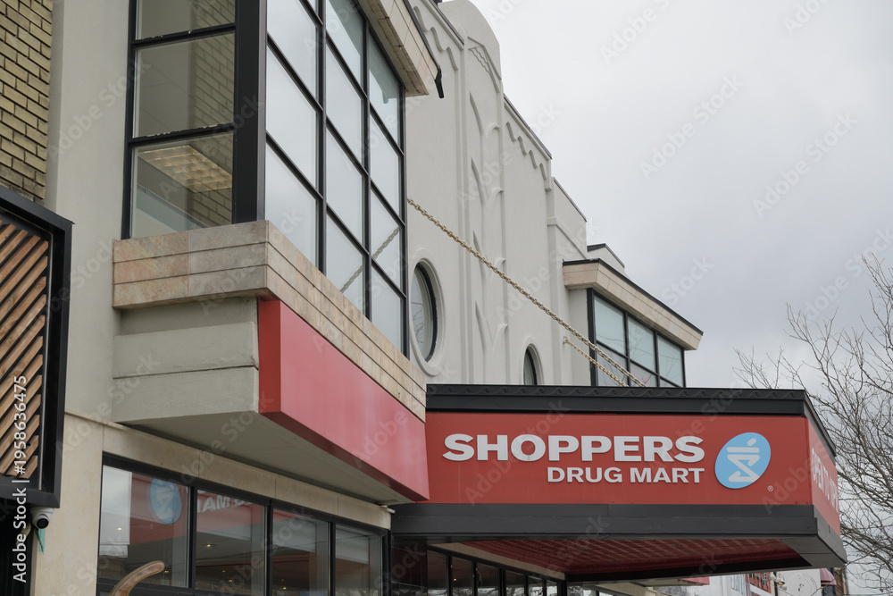 Fototapeta premium exterior building facade and sign of Shoppers Drug Mart, a pharmacy chain, located here at 1601 Bayview Av, East York, Toronto