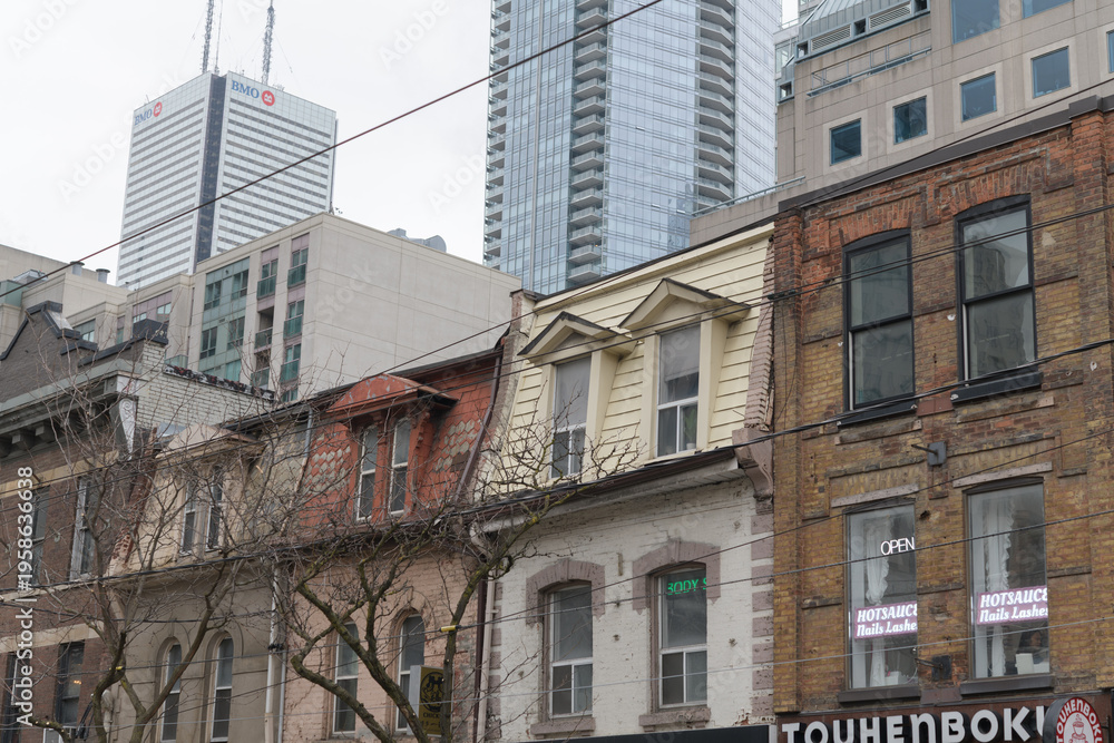 Fototapeta premium historic commercial building facades and sign of Touhenboku Ramen located at 261 Queen St W, Toronto