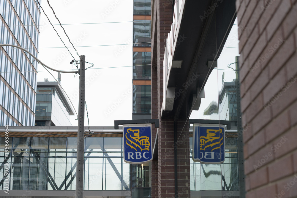 Fototapeta premium wall mounted projecting sign outside RBC Royal Bank - Meeting Place at 134 Queens Quay E, Toronto