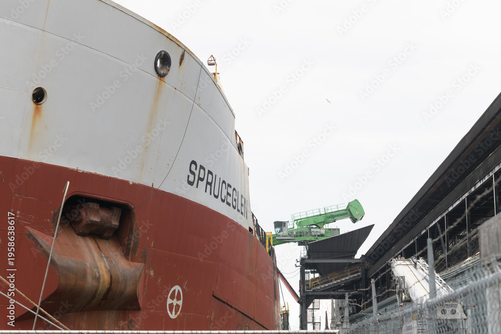 Fototapeta premium Spruceglen, a bulk carrier, owned by Canada Steamship Lines (CLS), at Redpath Sugar Refinery, docked at Lower Jarvis St slip, Toronto