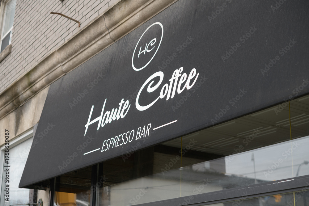 Fototapeta premium exterior building and awning sign of Haute Coffee, an espresso bar, located at 153 Dupont St, Toronto