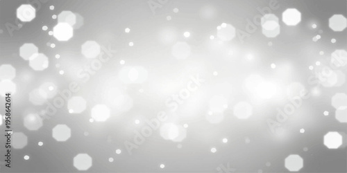 Blue abstract bokeh background with silver glitter and shiny sparkles for a bright winter Christmas holiday design