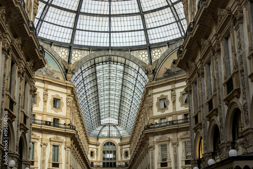 Wallpaper Mural Interior view of an milan galleria italy shopping arcade with a glass ceiling, showcasing symmetry, elegance, and historic design. Torontodigital.ca