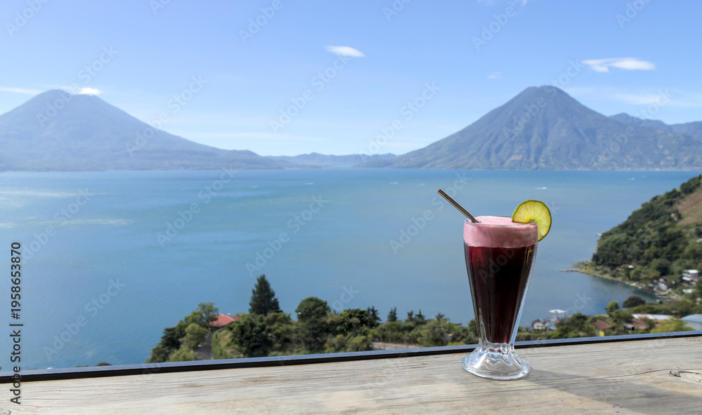 custom made wallpaper toronto digitalBeverage with lime garnish set against a scenic lake atitlan and volcano backdrop, relaxation and travel lifestyle smoothie