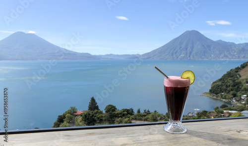 Wallpaper Mural Beverage with lime garnish set against a scenic lake atitlan and volcano backdrop, relaxation and travel lifestyle smoothie Torontodigital.ca
