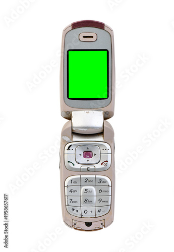 Silver flip mobile phone with green screen isolated on white background.