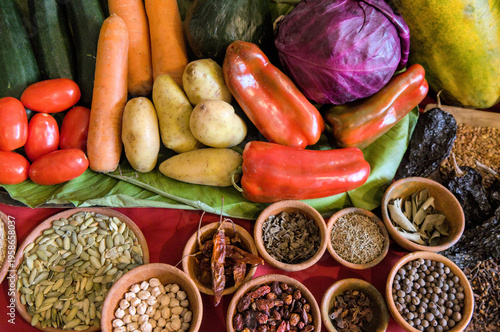 Wallpaper Mural Colorful assortment of fresh vegetables, seeds, and spices displayed on a market table, highlighting local agriculture, healthy ingredients, and vibrant culinary traditions. Torontodigital.ca