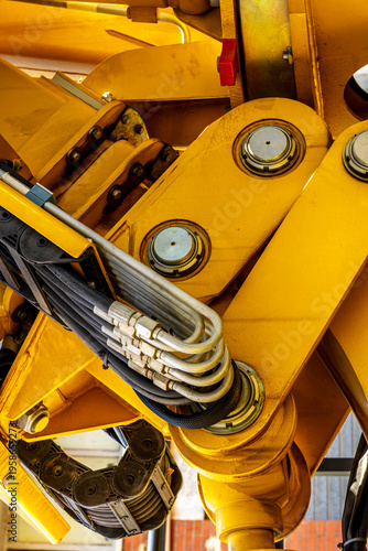  Induastrial machine pattern with yellow tolls and steel cable elements of industry production line on a factory. Manufacturing concept background for workplace desing .