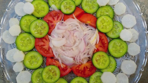 Fresh Vegetable Salad with Sliced Tomatoes, Onions, and Cucumbers