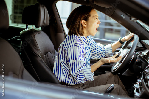 Korean woman driving car wh...