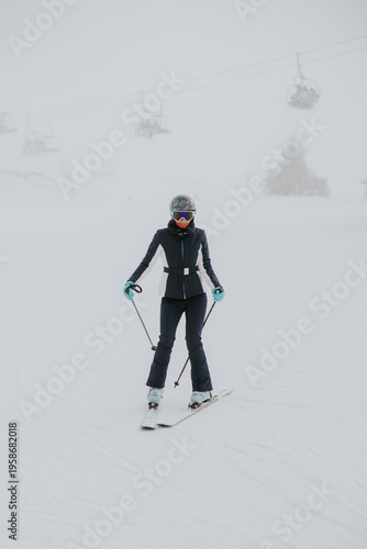 Skiing on a foggy day at th...