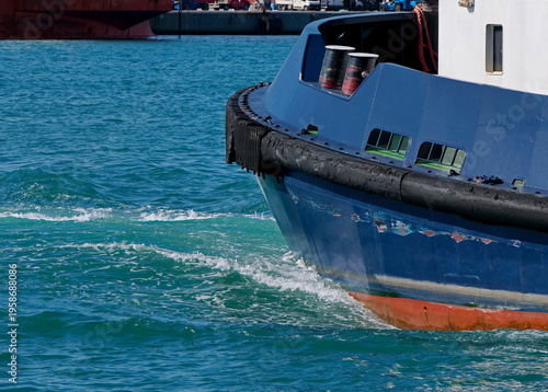 The hull of a tugboat at sea in the port