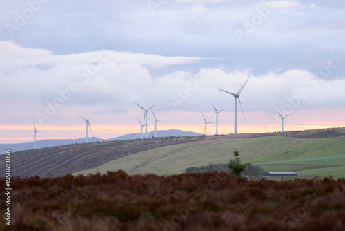 Photography Wind energy turbines generating clean power on welsh hills