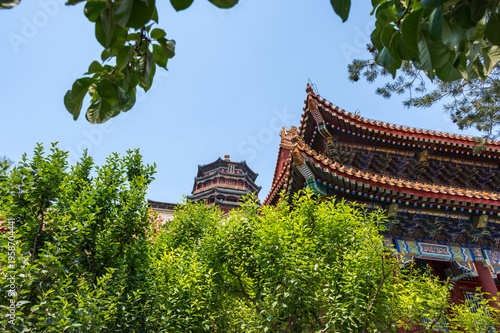 The majestic multi-tiered Tower of Buddhist Incense, showcasing its intricate colorful eaves and traditional architecture against a clear blue sky at the Summer Palace in Beijing, China - 27 May 2025