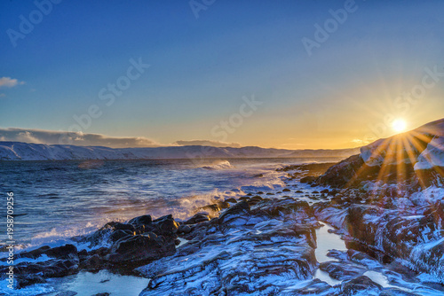 Bright dawn on the coast of the Barents Sea in the village of Teriberka in the Murmansk region of Russia