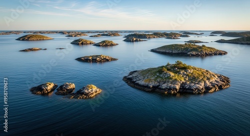 Serene Archipelago with Rocky Islands and Calm Blue Water at Sunset
