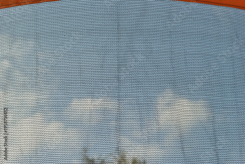Safety Netting on Outdoor Trampoline in Close Up against Blue Sky 