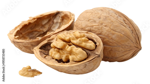 Walnuts on a black background one cracked open to reveal its kernel