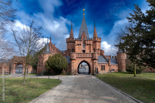 Hradec nad Moravicí, Moravian-Silesian Region, Czech Republic, March 21, 2026: Red Castle main gate and towers under dramatic cloudy sky