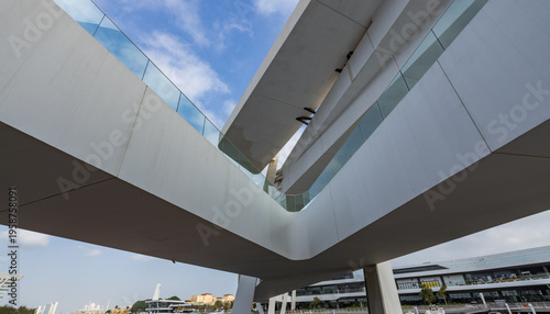 Wallpaper Mural Modern architecture curves gracefully under clear blue sky Torontodigital.ca