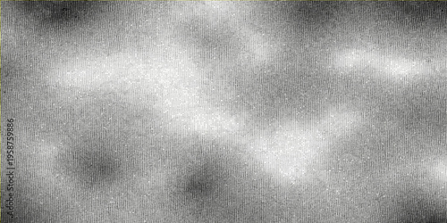 A dark vintage brushed metal plate texture features a rough gray steel surface with an aged grunge pattern and black paint details on a blank textured material backdrop