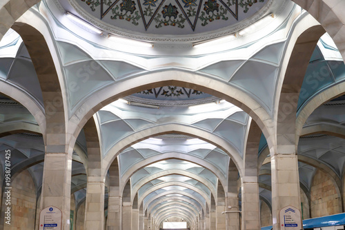 Low angle view of the ornate domed ceiling and white marble arches with traditional patterns at Alisher Navoiy subway station, Tashkent (Toshkent), Uzbekistan (O'zbekiston)