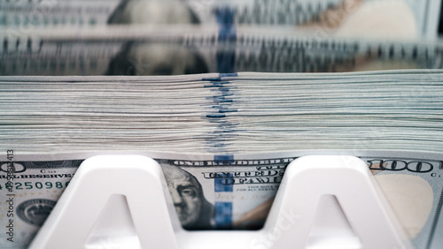 Konstfotografi Money counting machine processing stacks of cash with detailed view of hundred-d