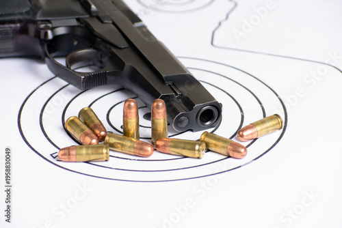 Compact 9mm Handgun and Ammo on Tactical Shooting Targets