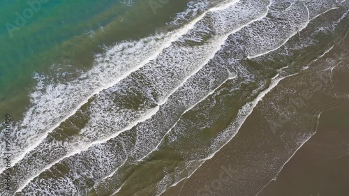 Aerial drone view of a sandy beach on the English Channel coast of Normandy, France. High quality 4k footage