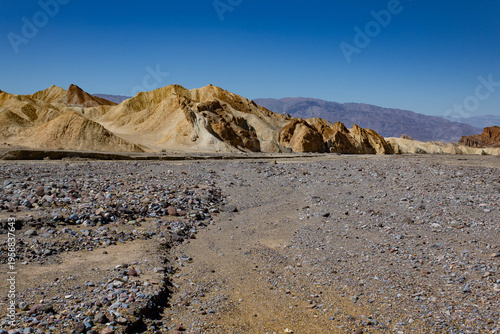 photo of colorful pebbles and stones in washout in Death Valley National Park
