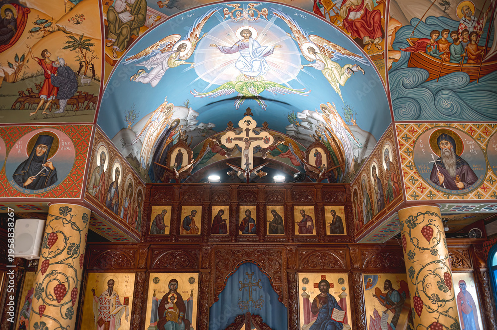 Obraz premium Agios Nikolaos church interior with detailed Byzantine art, frescoes, and a wooden iconostasis. Protaras