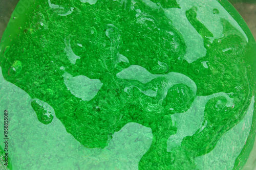 Фотография thick green gel soap with bubbles in it