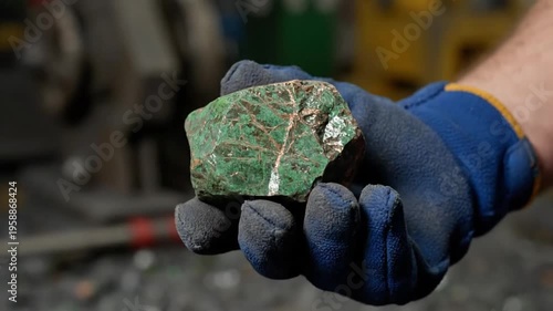 Close-Up Green Copper Ore in Worker’s Hand – Natural Mineral Texture and Mining Resource Detail