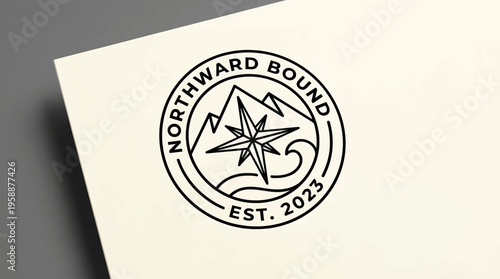 Elegant round logo design featuring a prominent compass star, majestic mountain peaks, and flowing ocean waves, symbolizing journey, discovery, and new beginnings
