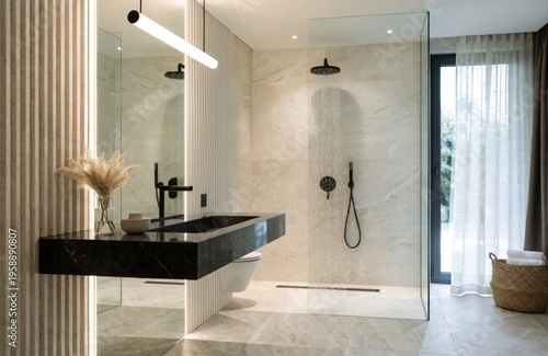 Modern bathroom with double sinks, gray tiles, and clean lines. A large mirror enhances the space