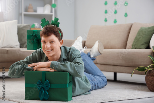 Redhead young man with gift...
