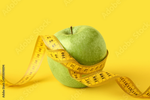 Green apple with measuring ...