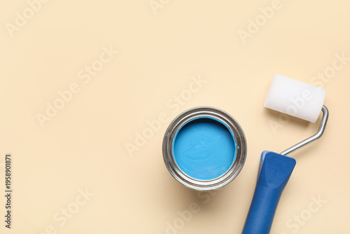 Can of paint with roller on...