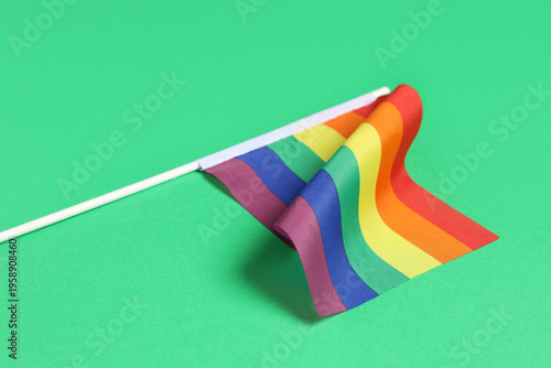 Rainbow flag on green backg...