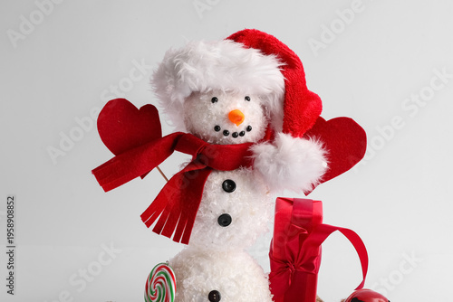 Funny snowman in Santa hat ...