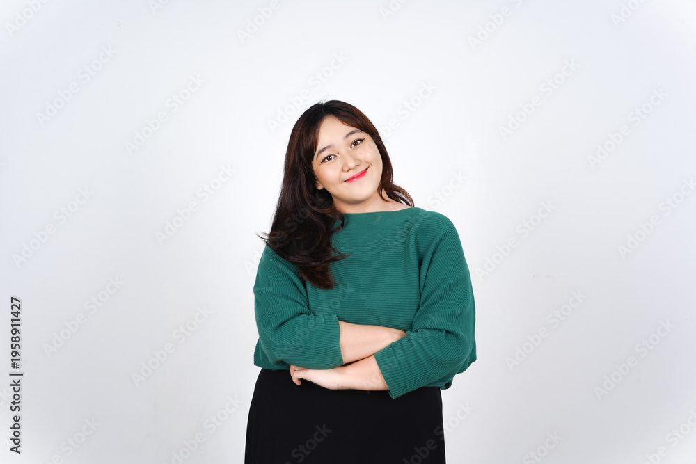 Fototapeta premium Confident and smiling young asian woman with arms crossed