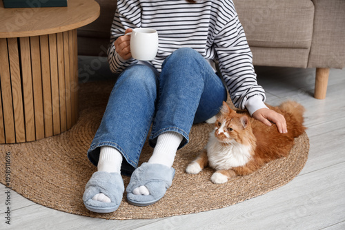 Woman in grey slippers with...