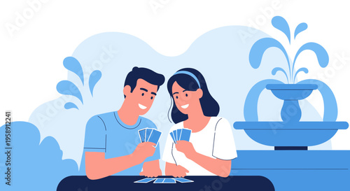 Couple Playing Cards By A Fountain In A Park Setting