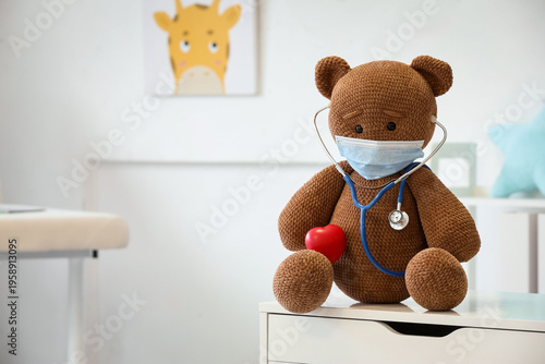 Toy bear with medical mask,...