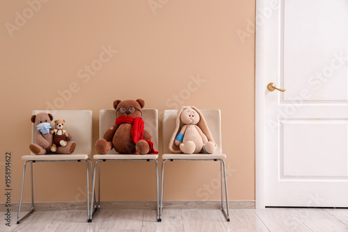 Ill toys on chairs near bei...