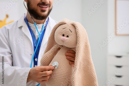 Male pediatrician with stet...