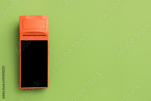 Payment terminal on green b...